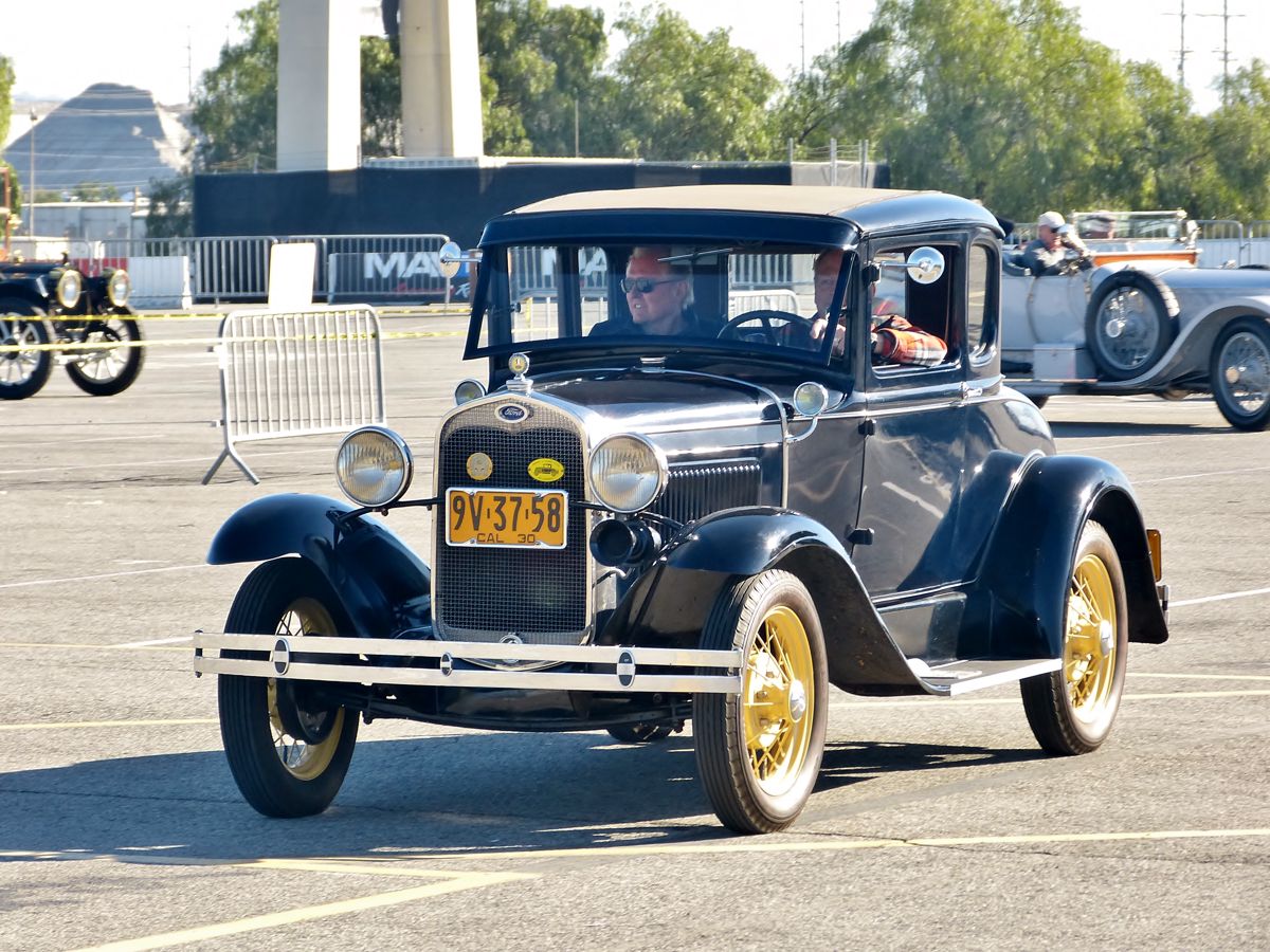 And Away They Go...part of the fun of this event is watching and listening to, the old cars take off on the tour.