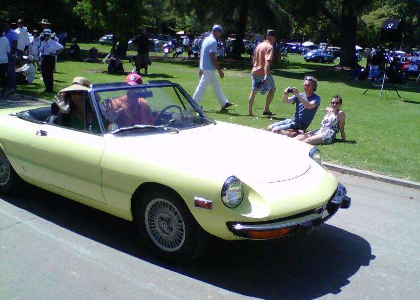 My friends Jeff and Margaret in their '74 Alfa Spyder en route to the trophy stand to pick up their hard earned and well deserved first in class trophy.  This car is no trailered show pony but an often street driven machine that's seen more than its fair share of road rallyes and every day use.  Plus lots of recent detailing and hard work.  Yay!