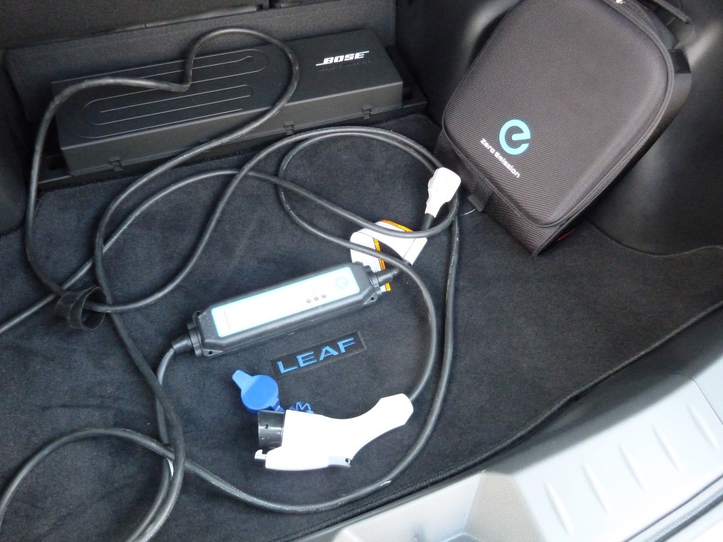 The compact, lightweight 110Volt charger stores in its own dufflebag in the rear cargo area, and should always be with you, so you can top off your charge at work, motels, anywhere the long cord will reach a household plug.