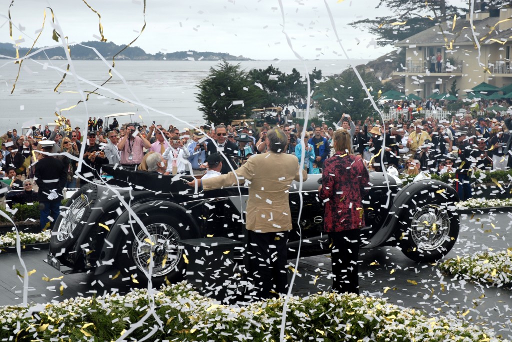 Edward Herrmann was always the master of all he surveyed; here calling the shots of another Best of Show winner at Pebble Beach, with Concours Chaiman Sandra Button just to his right