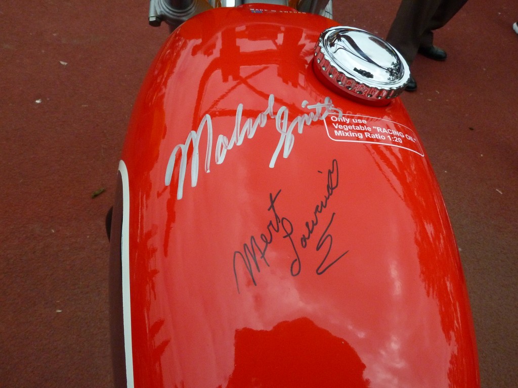 This Husqvarna tank is signed by two of On Any Sunday's three great stars, the incomparable Malcolm Smith and awesome dirt track bike racer Mert Lawill.