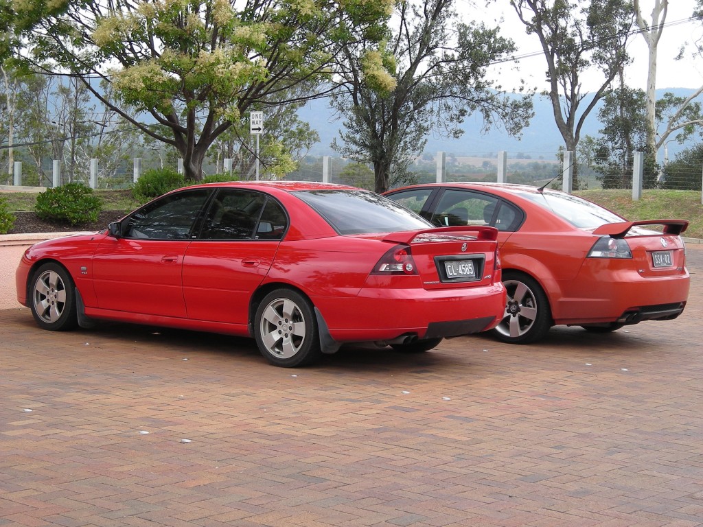 "My" SSV, on the right, parked next to a local out on the street, at left.  The other car was one generation older than mine, but still made of much the same stuff.  Remember that this car was the Pontiac G8 for a while.