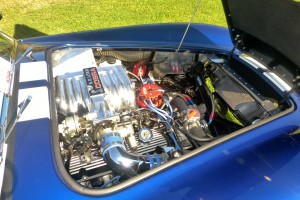 Late model fuel injection 5.0 V-8 screams Mustang engine and replica -- the original wouldn't be this shiny or polished, and had a Holly car sitting on top. This certainly looks wrong but must run great.