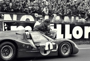 Le Mans Magic, 1967. Foyt is still at the wheel of the winning Ford while teammate Gurney hops aboard for a victory lap.