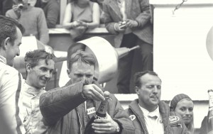 Champagne too good to waste, but worth the birth of a great tradition as Dan sprays the bubbly and Foyt looks on from behind.
